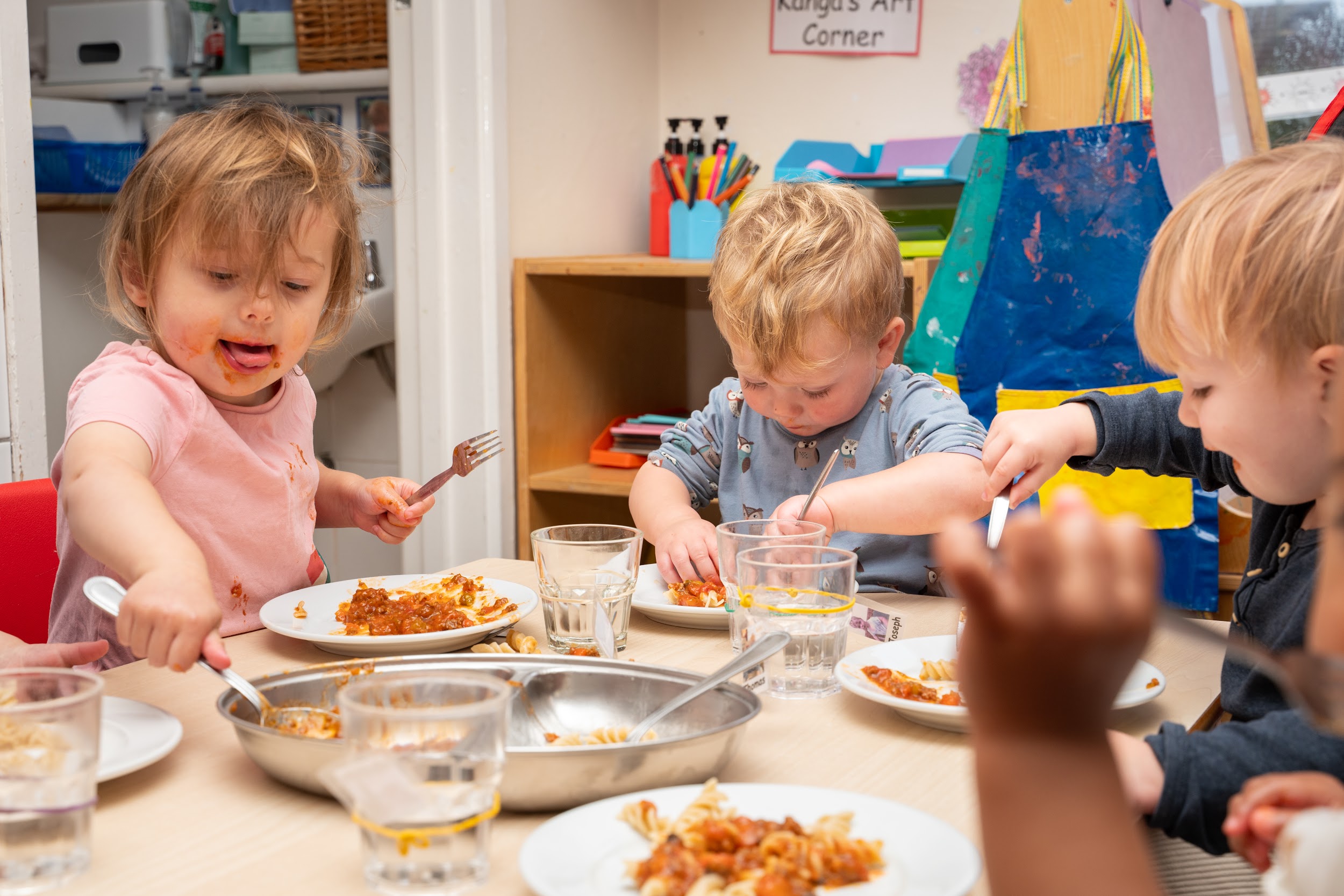 Happy children enjoying their meal